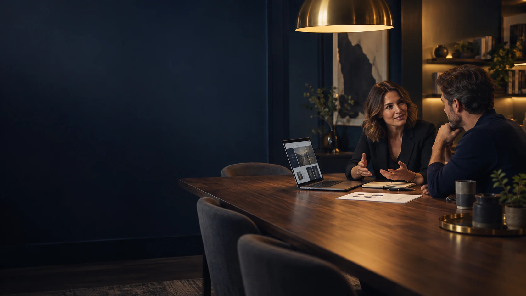 Consultant and client discussing a connected digital strategy in a real studio